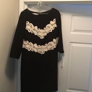 Never been worn a-line dress. Approx. Knee length